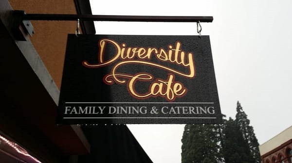 A logo for Diversity Cafe
