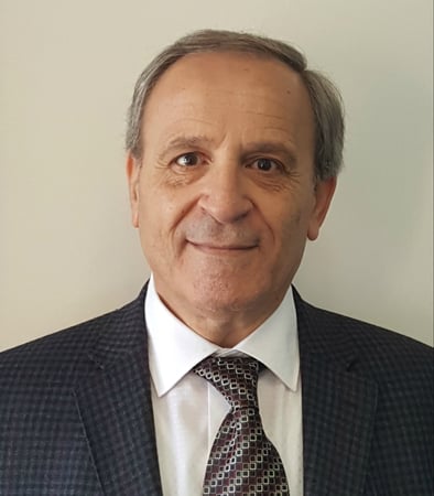 Male agent Andrew Tero profile photo in front of a blue background