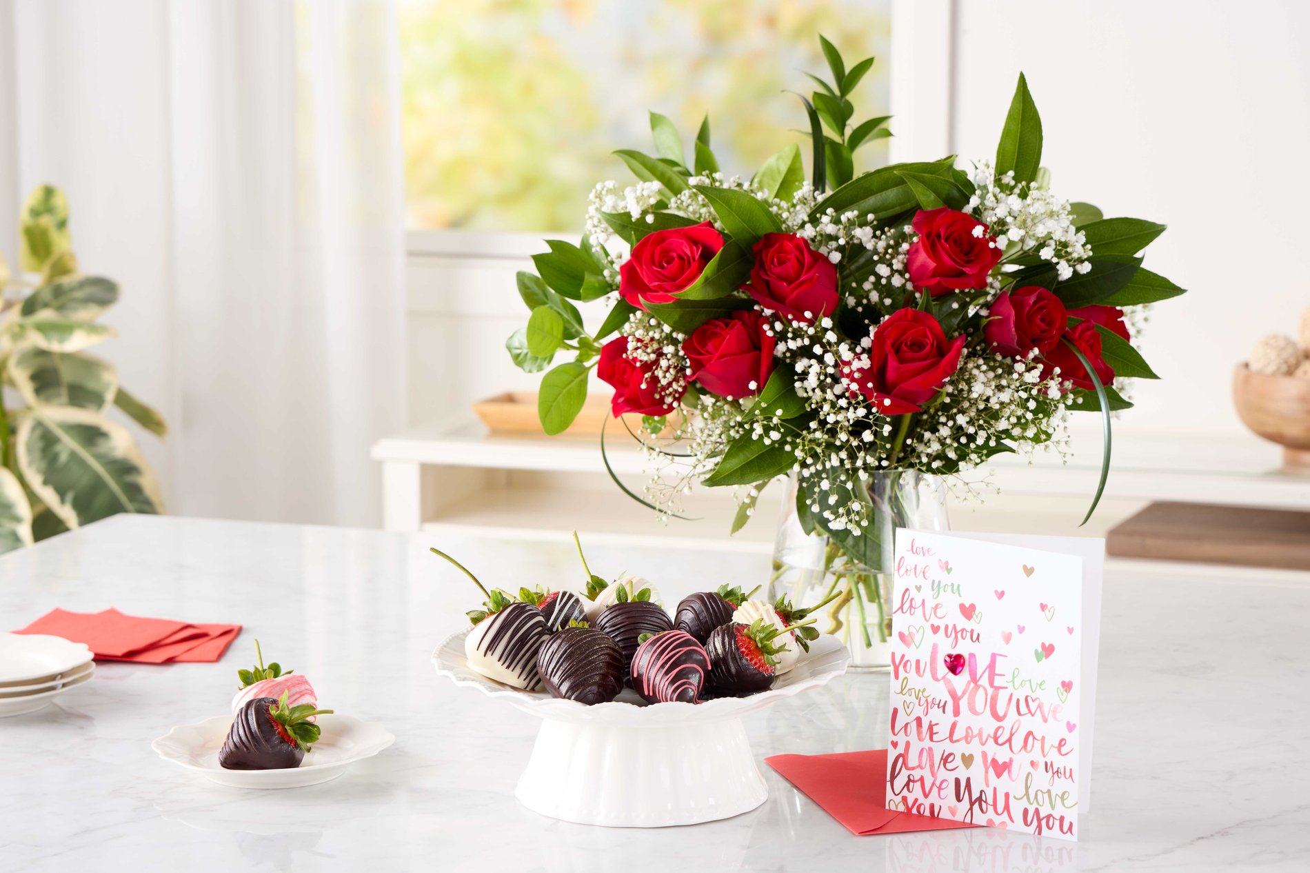 valentines day bouquet of roses and chocolate covered strawberries