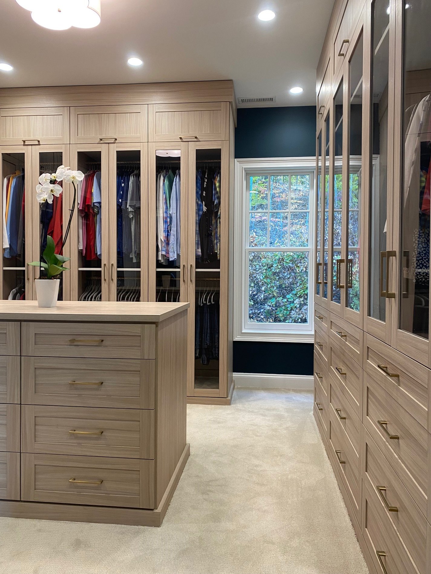 Walk-in Closet with Center Island Light wood finish walk-in closet with center island
