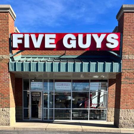 Exterior photograph of the Five Guys restaurant at 2170 Millennium Boulevard in Cortland, Ohio.