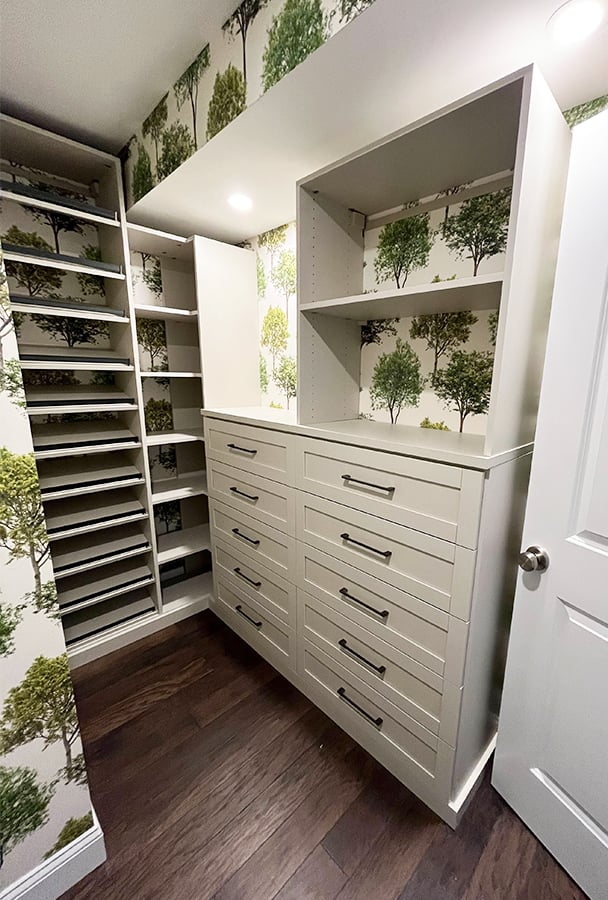 Custom Built In Closet Shelves | California Closets Southern New Jersey Walk in closet with custom built in shelving and drawers in light wood finish by California Closets Southern New Jersey