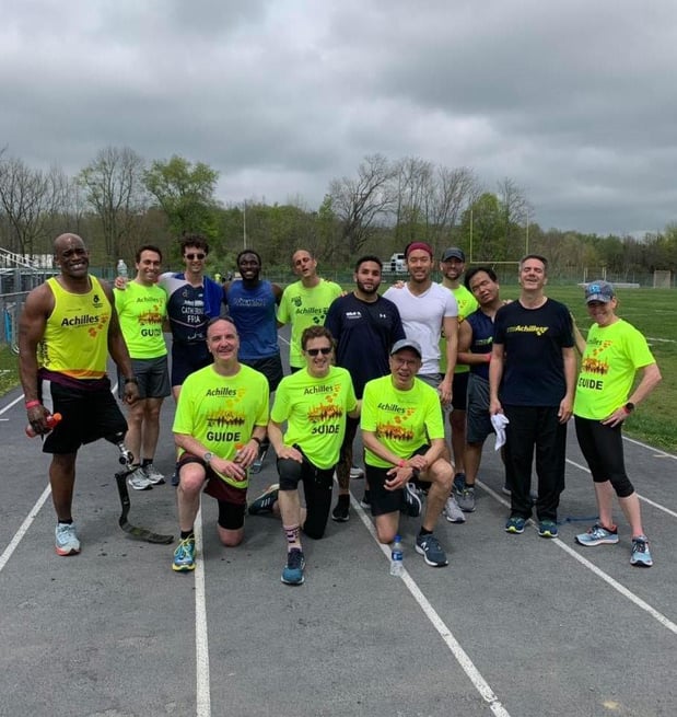 Agent Donn Sharer volunteers as a guide for Achilles International Triathlon Camp.