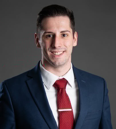 Male agent Stephen Azzarone profile photo in front of a blue background