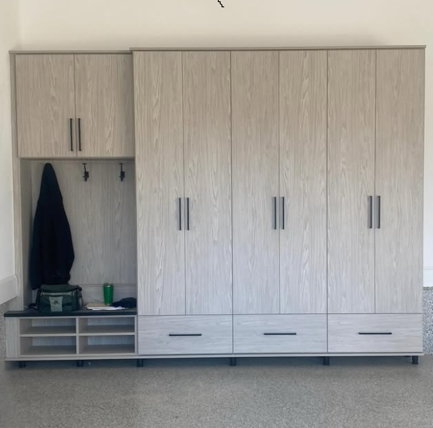 Custom Garage storage Light grey toned garage storage cabinets designed by California Closets Greenwich, Connecticut