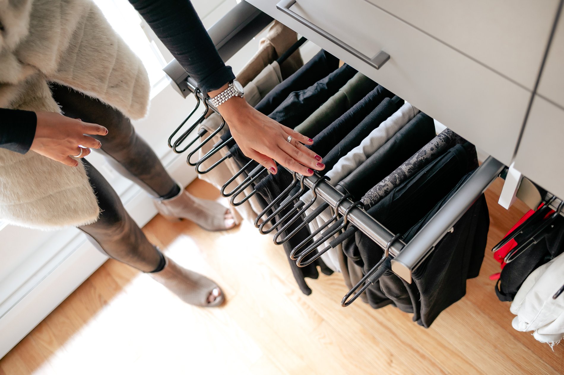 Pullout clothing hangers Top down view of pull out pants hanging rack