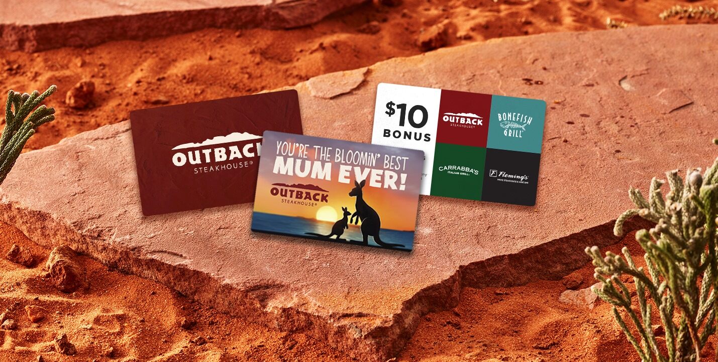 Three Outback gift cards on a rock.