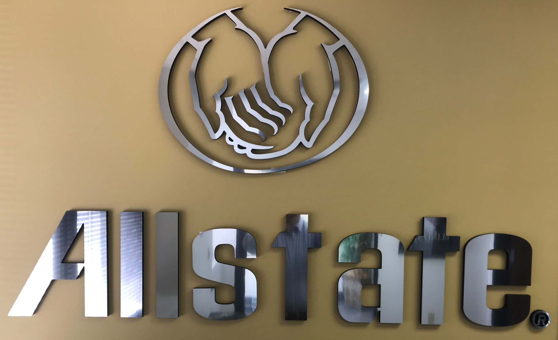 Allstate Signage on yellow wall inside office