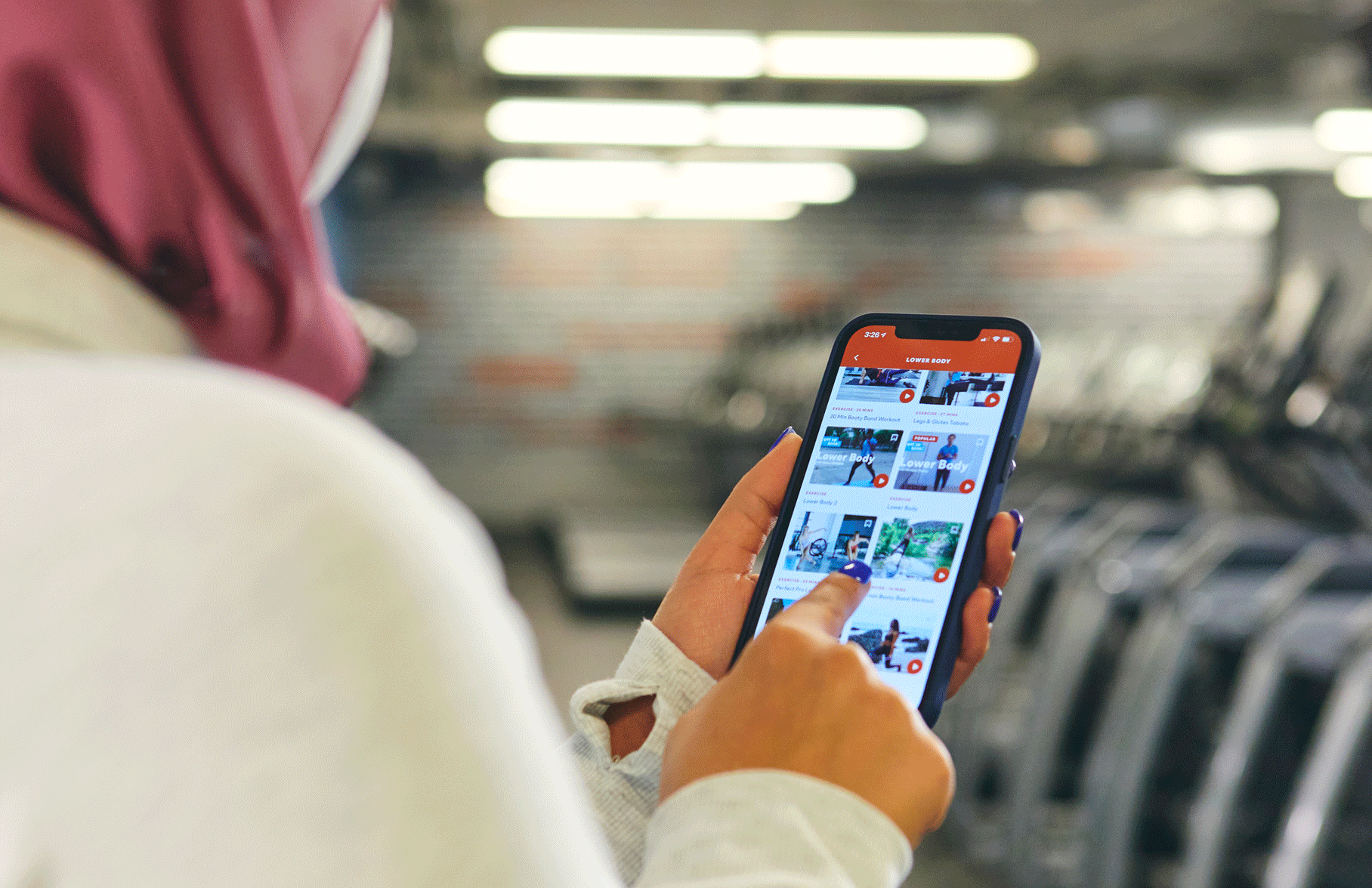 woman holding a smartphone displaying the blink app