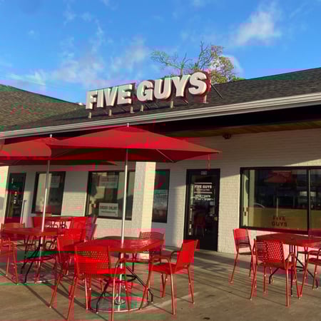 Exterior photograph of the Five Guys restaurant at 978 Main Street in Weymouth, Massachusetts.