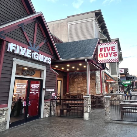 Exterior photograph of the Five Guys restaurant at 815-1 Parkway in Gatlinburg, Tennessee.