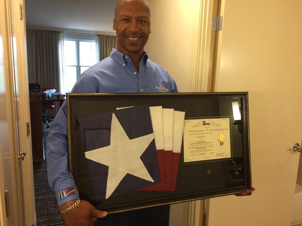 Agent holding Texas flag