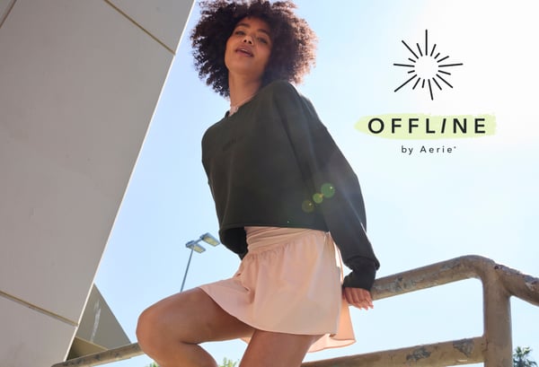 Woman wearing skirt and sweatshirt