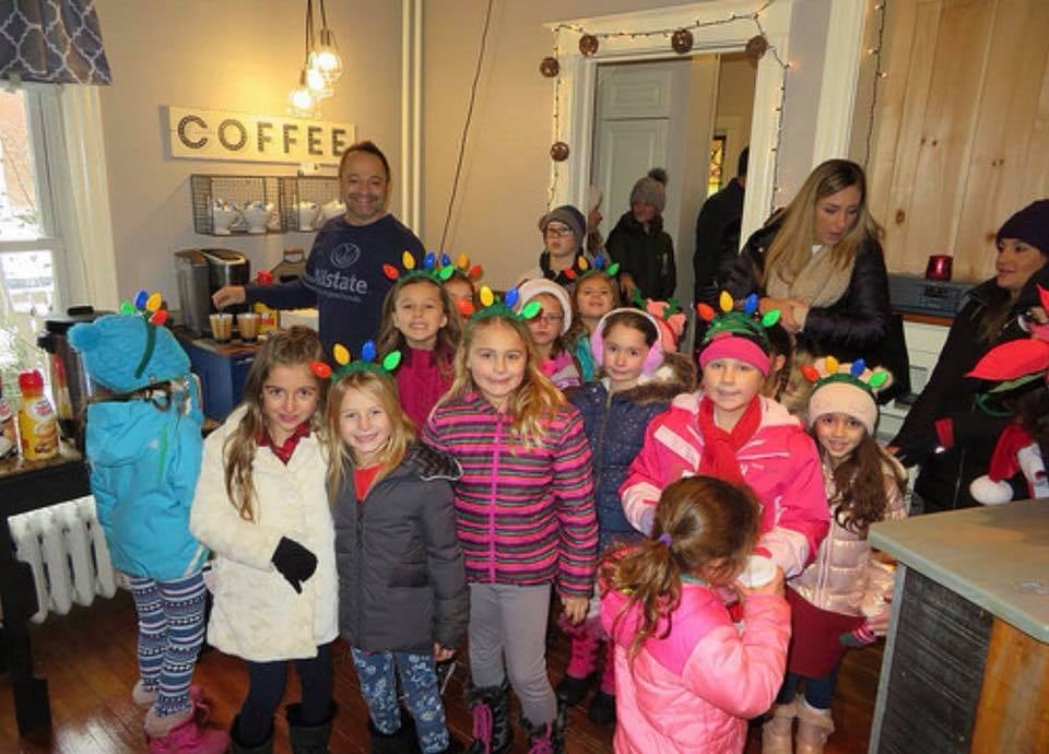 Kris Oviatt handing out cookies and hot cocoa to visitors during our Christmas In The Center open house. It was great to meet so many of our neighbors!