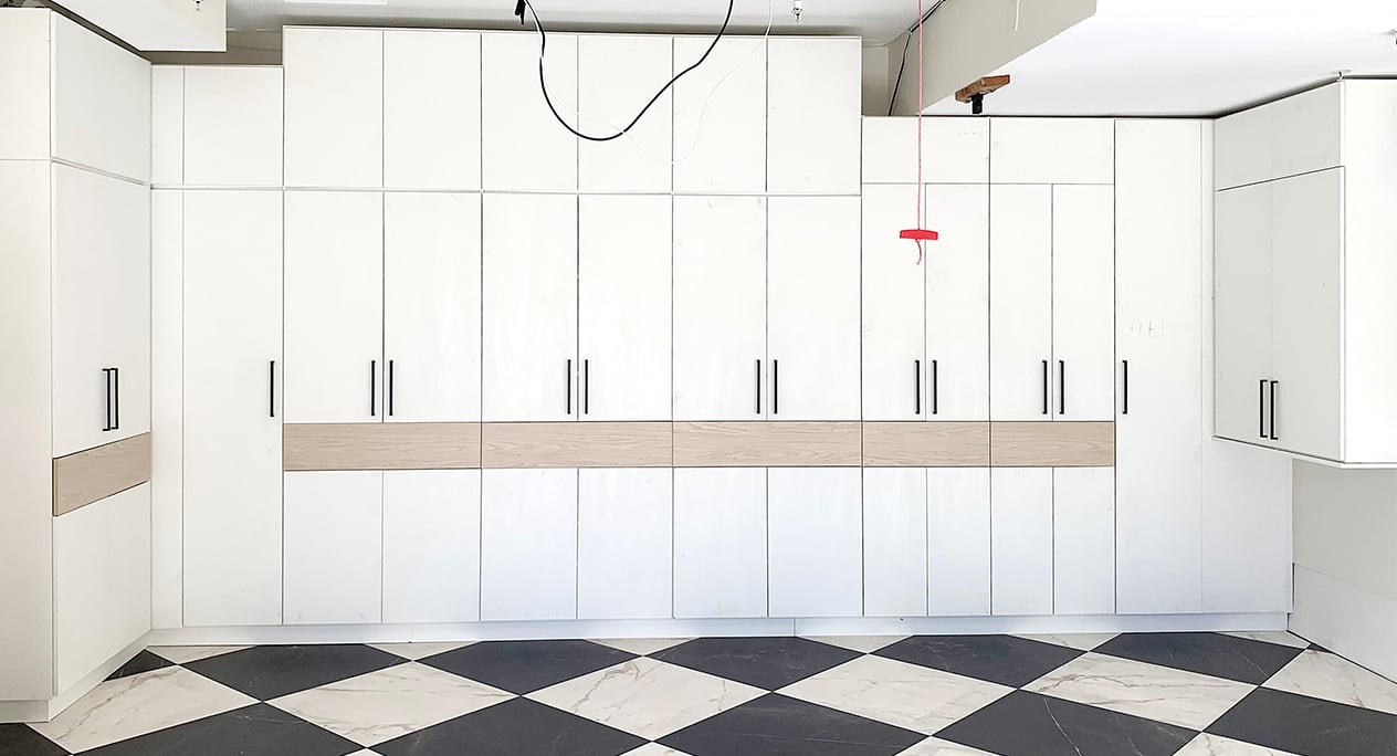 Garage Storage Cabinets | California Closets Orange County High end garage storage design with built in cabinets for organization by California Closets Orange County