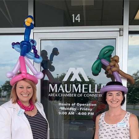 Maumelle Chamber members posing for picture with balloon hats on.