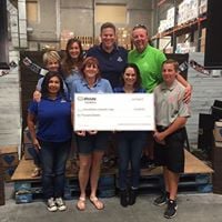 Allstaters packing food for Children's Hunger Fund and offering a grant