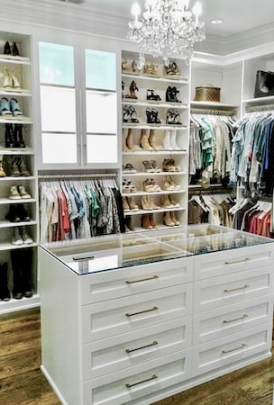 White walk-in closet with center island White walk-in closet with center island