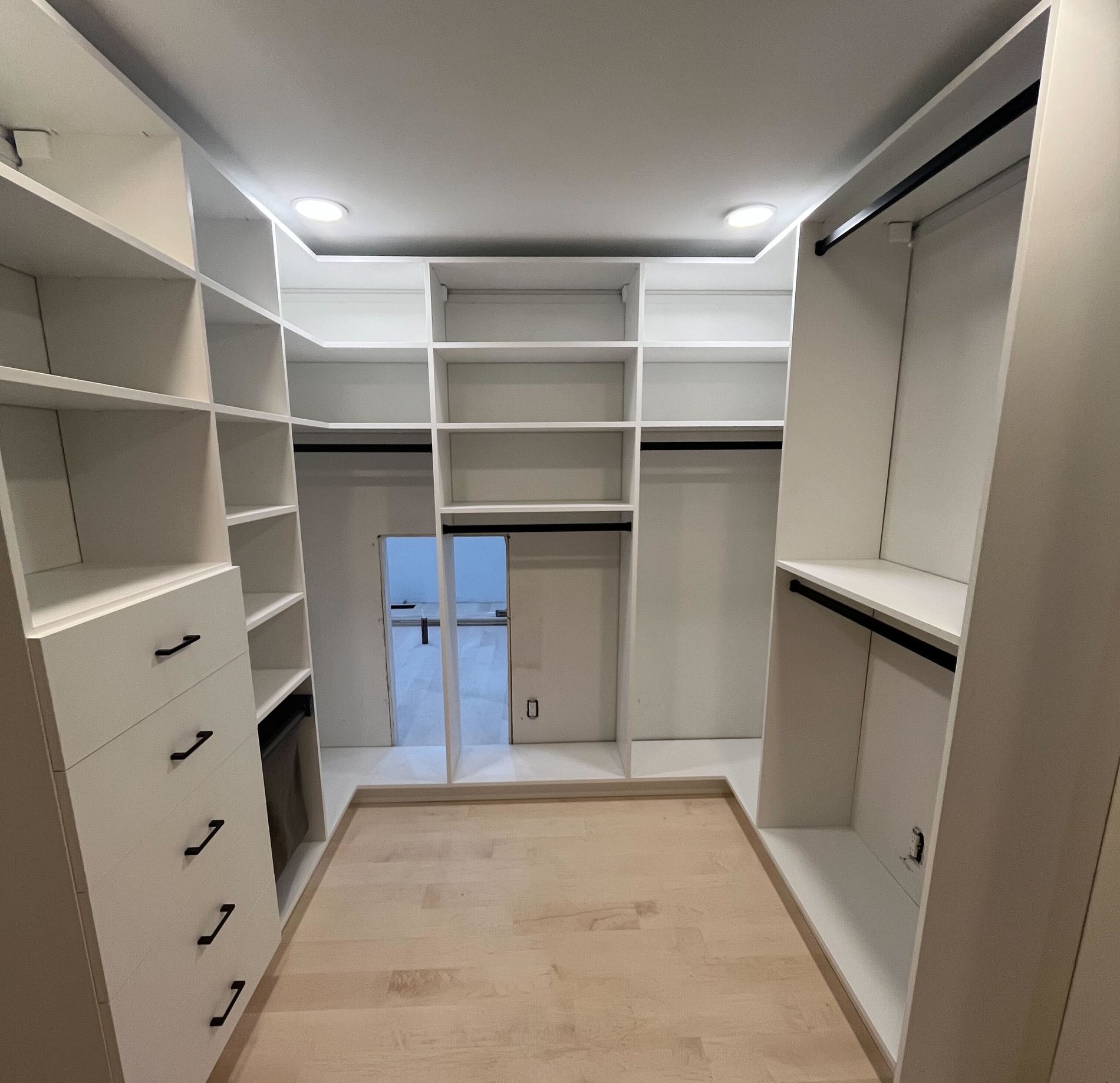 Custom Walk-In custom walk In closet with a secret door