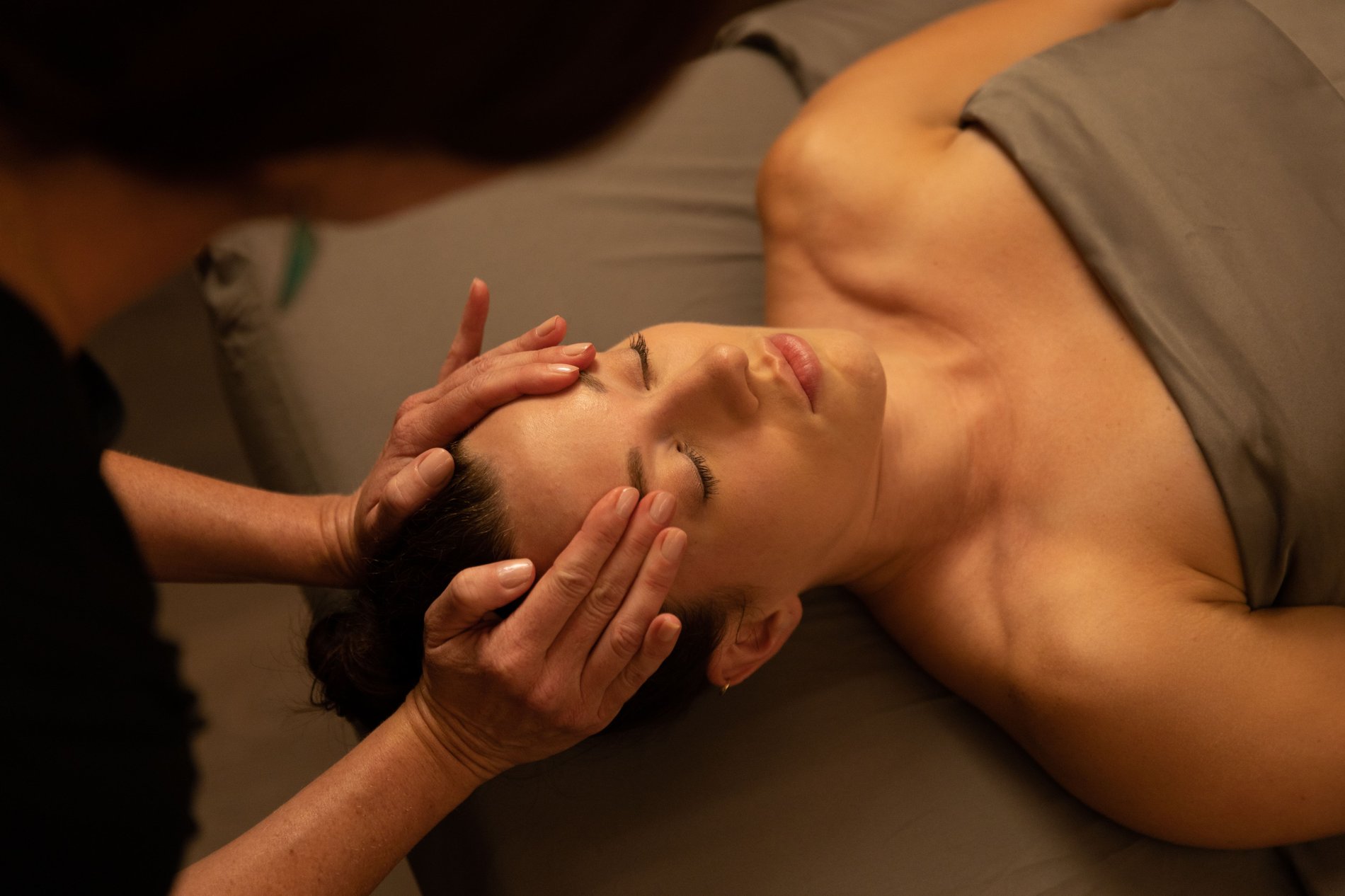 woman relaxing while receiving a luxurious Woodhouse facial