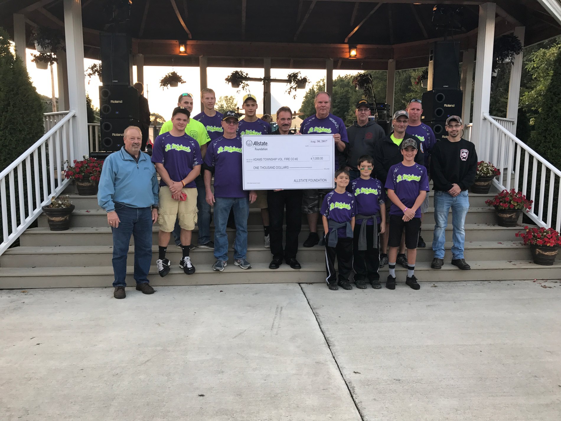 Duaine Detrick (Allstate agency owner) presents a $1,000 Allstate Foundation Hands in the Community Grant check as a volunteer to Adams Twp. Fire Station #2.