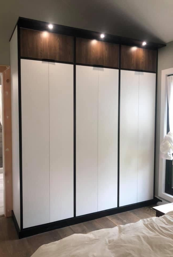 Custom Storage Wardrobe Custom storage wardrobe, separated into three sections, with the ability to store clothing or accessories.