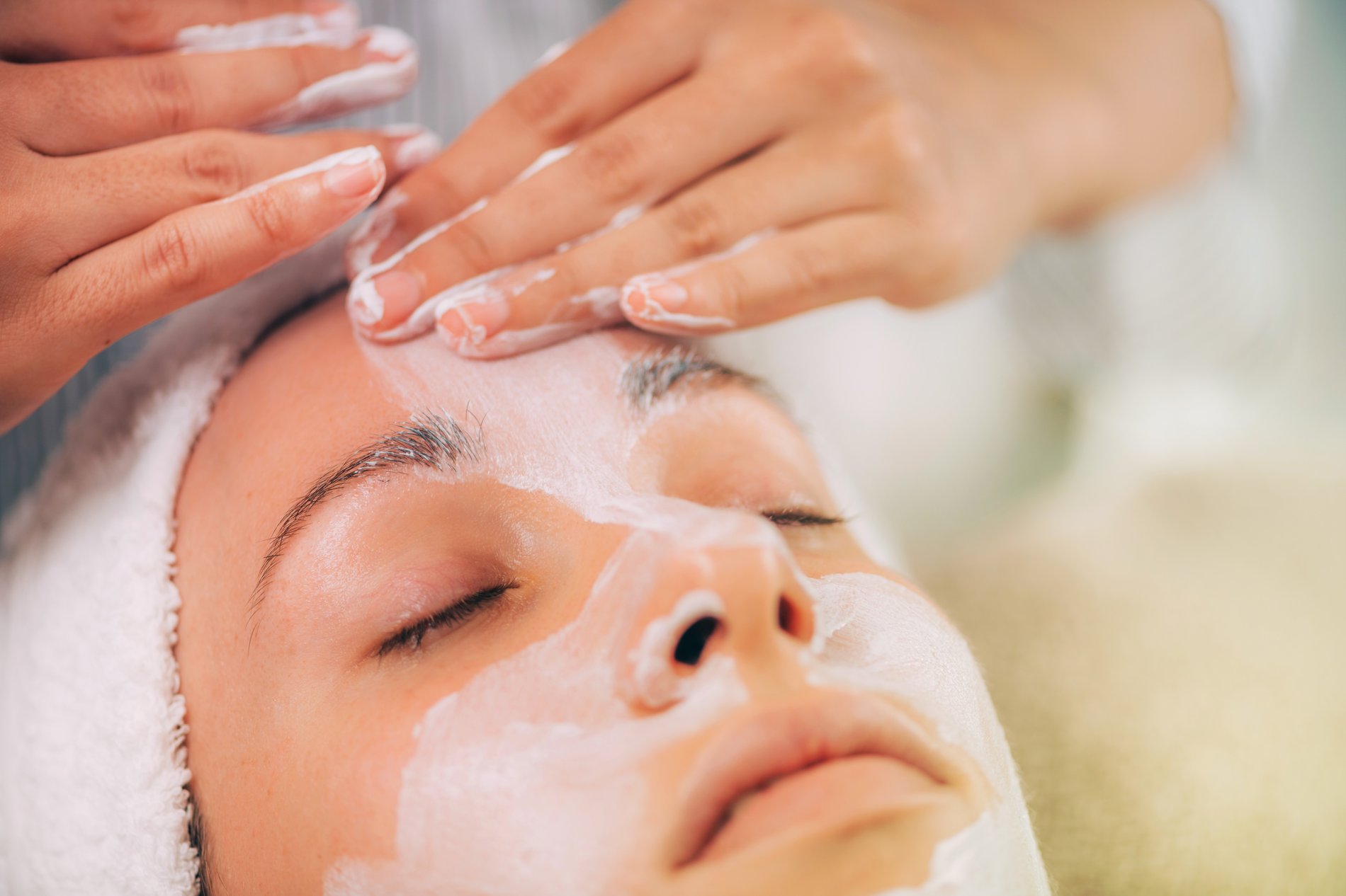 Women enjoying a complimentary mask fascial enhancement.