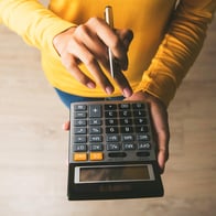 hands using calculator
