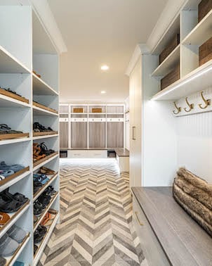 Custom Family Mudroom Large family mudroom with bench seating and lighting.