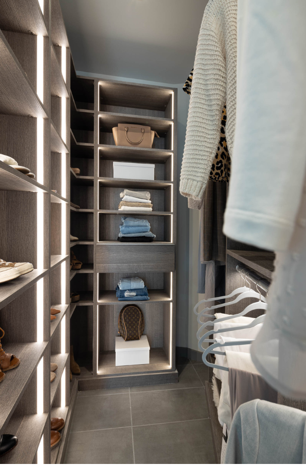 Luminous Walk-in Closet Dark gray custom walk-in closet with LED par lighting, custom shelving for every size, and hanging Putnam County New York