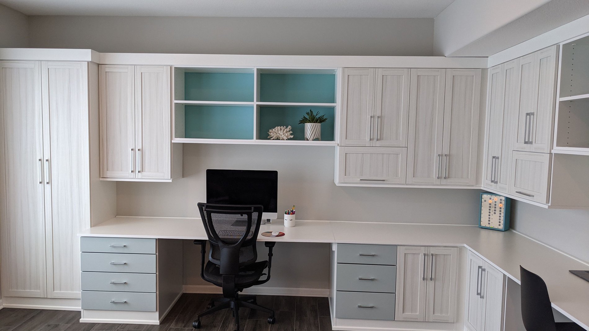 White Office Space Contemporary built-in office space with blue and grey accents.