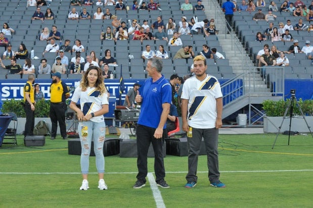 On the field with two very talented Special Olympians! Getting ready to deliver the game ball to the LA Galaxy mascot.
