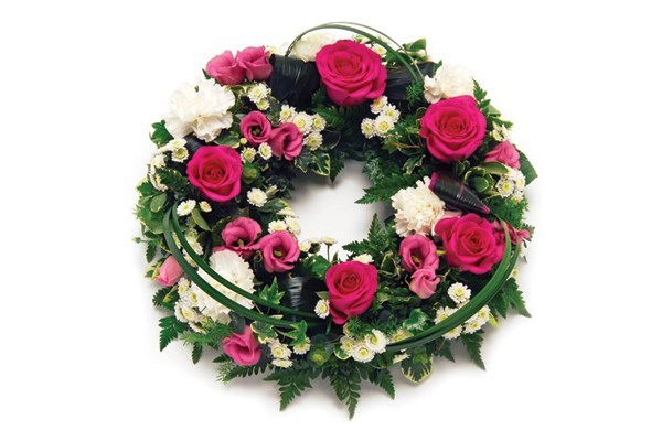 An example Open Wreath, a rose floral tribute with a mix of pink and white flowers