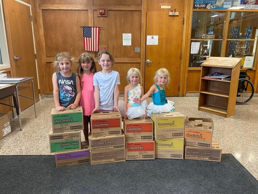 Girl Scout troop 60355 donated Girl Scout Cookies to the back pack program at South Jefferson Elementary