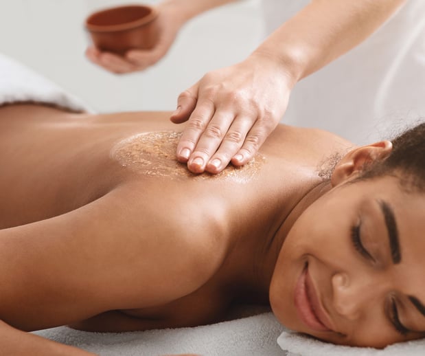 women enjoying a salt scrub at Woodhouse.