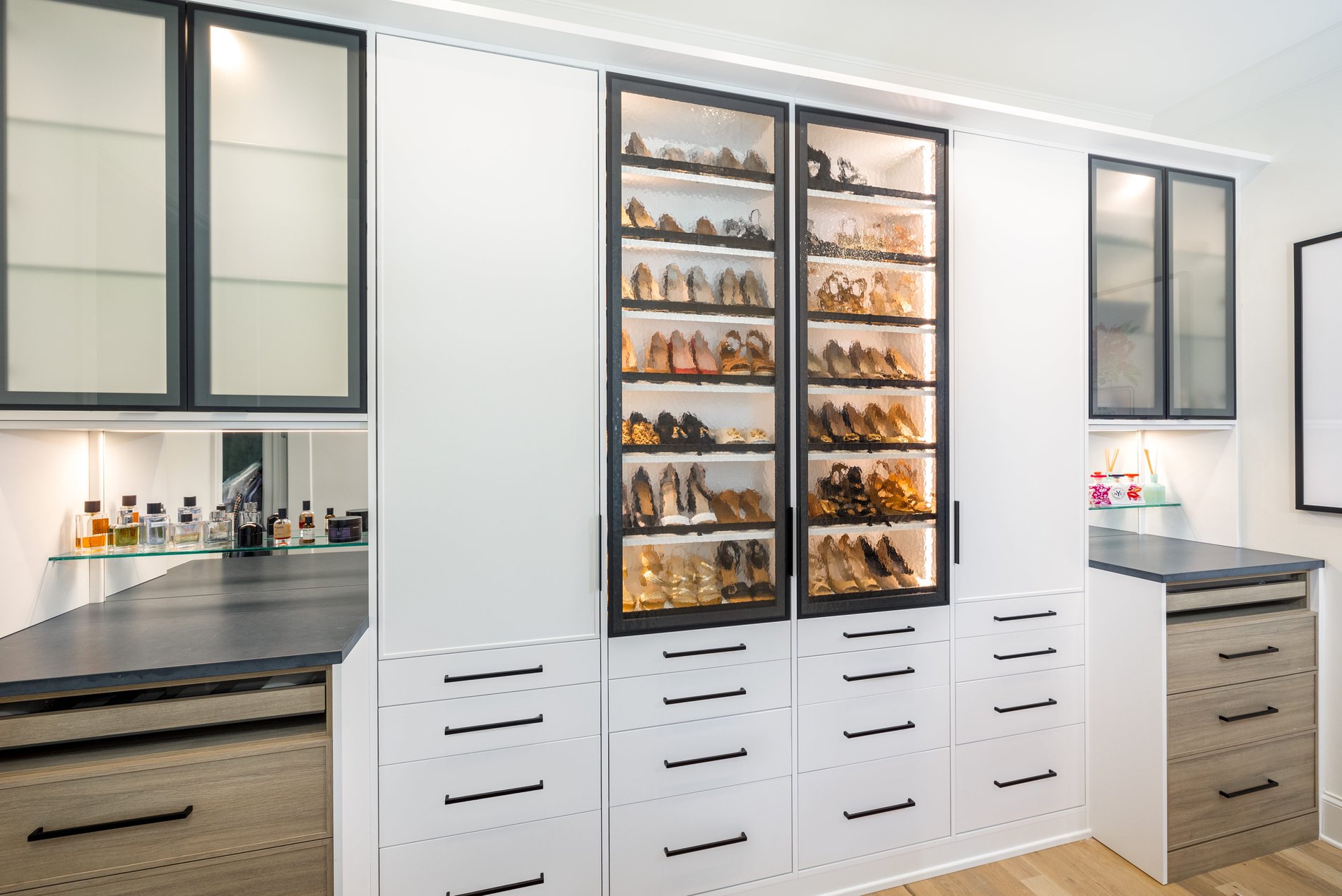 Dual Closet with Shoe Storage Display | California Closets Memphis Dual closet with lighted shoe storage and custom drawers by California Closets Memphis. Tennessee.