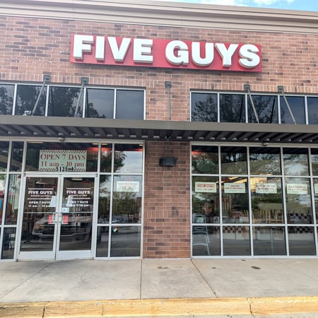 Exterior photograph of the Five Guys at 5135 Sunset Boulevard in Lexington, South Carolina.