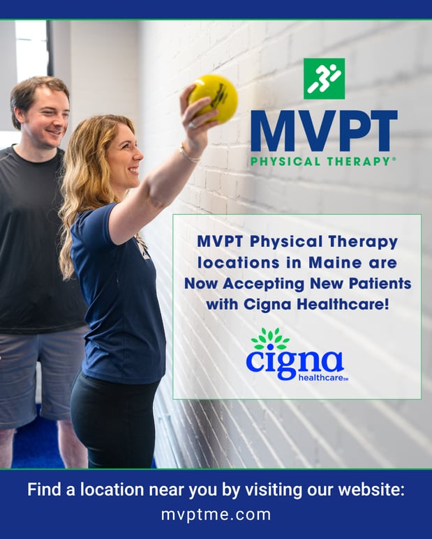 Physical therapist assisting a patient with a shoulder exercise in an MVPT Physical Therapy clinic in Maine, now accepting Cigna Healthcare.