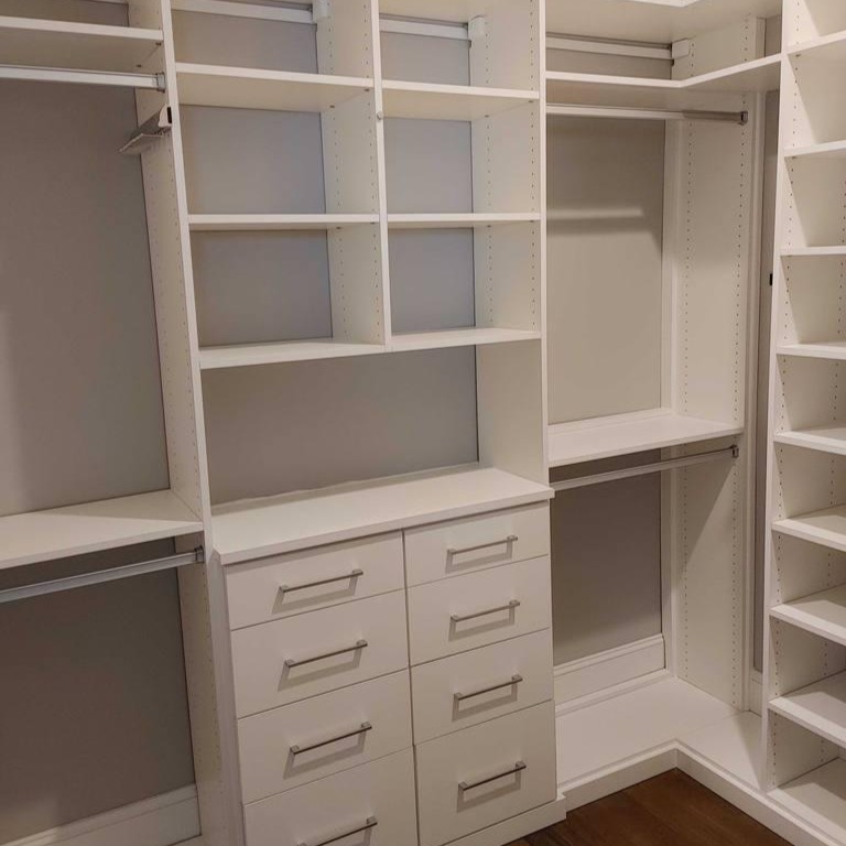 Walk-in closet White closet with floor-to-ceiling shelves