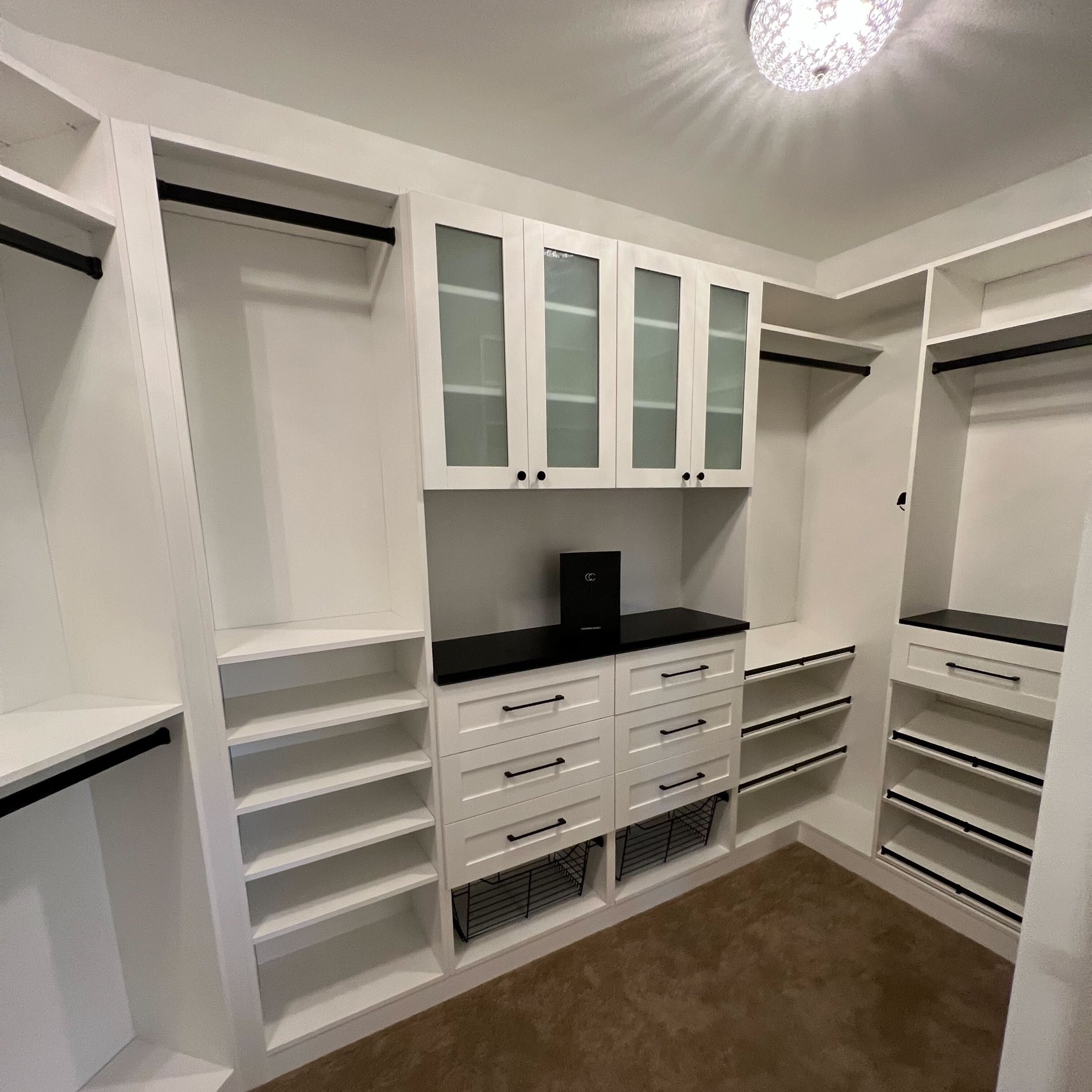 Primary Walk In Closet Master Walk In Closet with hanging space and drawers for organizing coats and accessories