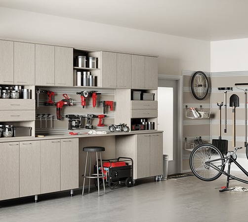 Garage Storage Workbench | California Closets Tampa Bay Garage storage with cabinets, drawers, workbench, and tool rack by California Closets Tampa Bay, Florida.