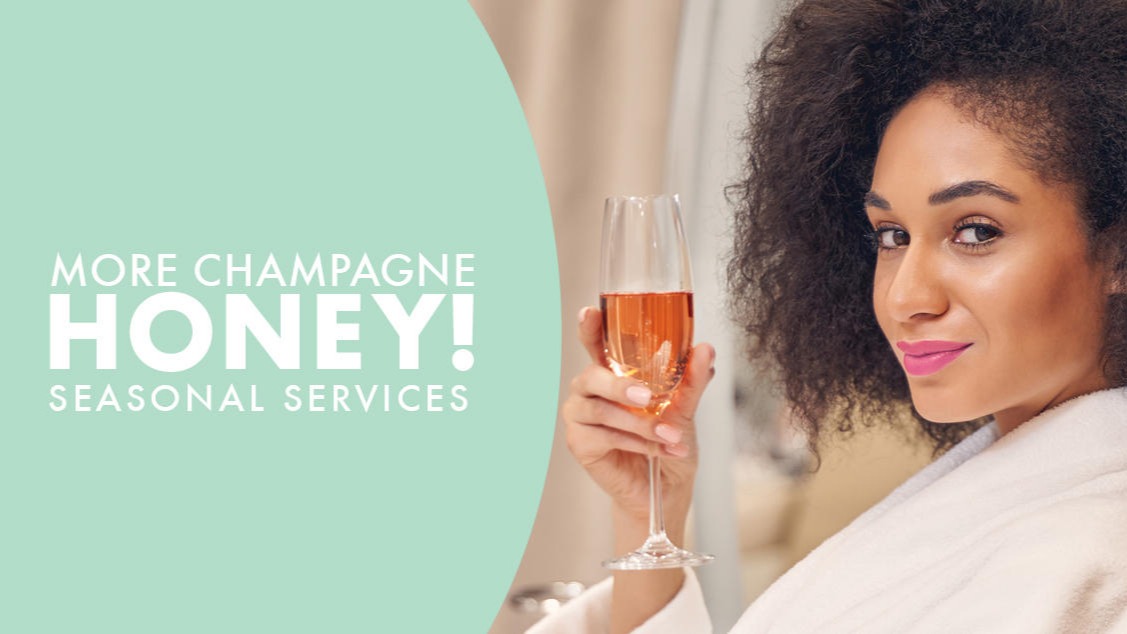 spa woman holding glass of champagne