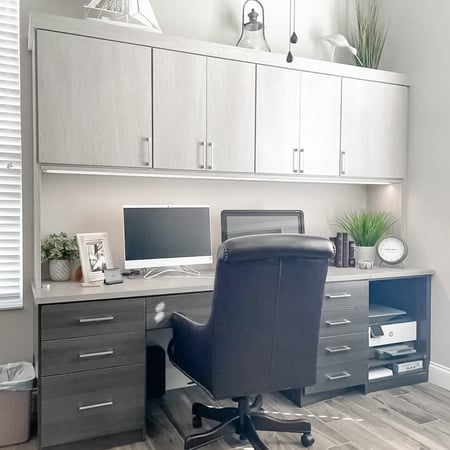 Home office with cabinets in light gray by California Closets St. Petersburg, Florida.