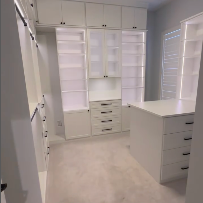 Luxe White Walk-In Closet Belissima White walk-in closet with mirrors and lighting