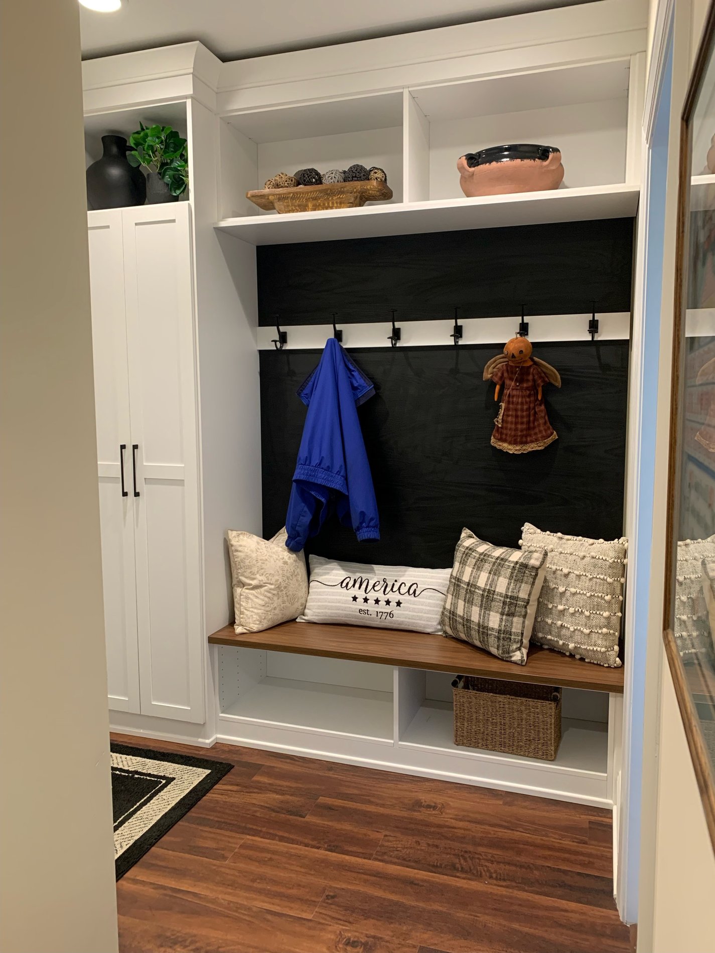 Mudroom Custom mudroom with coat hooks, seating, and shelving.