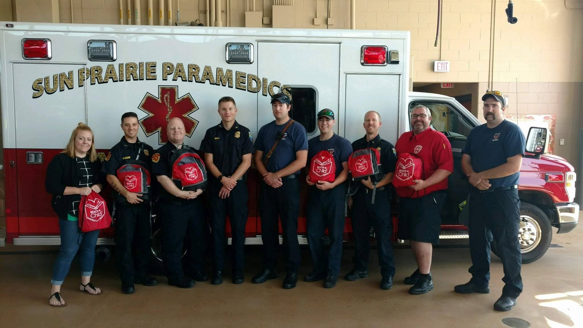 On Friday, September 8th, Allstate Insurance Agent: Monica Titley joined us for a REACH BAG refill to the Sun Prairie EMS Department. This department along with the Sun Prairie Fire Department is sponsored by Monica Titley.
Due to her continued support and the assistance of these First Responders, they will be able to comfort and distract an additional 30 children-in-crisis situations.