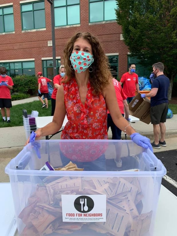Christine Angles, Manassas Virginia Allstate insurance agent, was happy to volunteer at the Food for Neighbors Red Bag event.