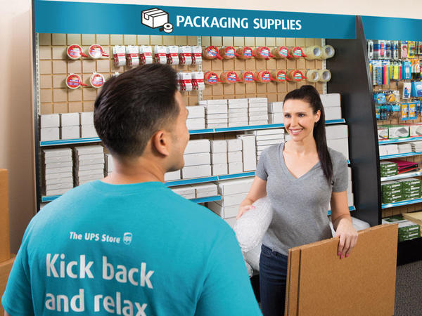 Man and woman selecting packing & shipping supplies
