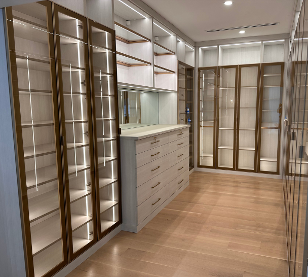 Elegant White and Gold Walk-in Closet California Closets Long Island NY walk in closet design custom closets closet designers designer closets closet shoe storage built-in closets closet systems closet drawer organization closet shelf organizer