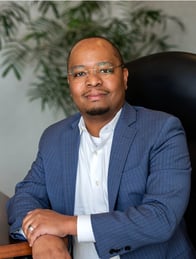 Headshot of Lee Muthama